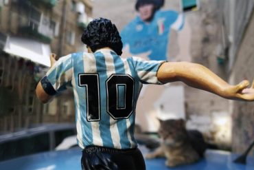 Naples Maradona mural and action-figure.