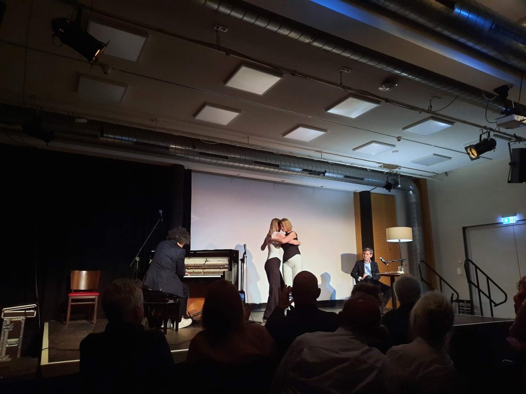 2 women doing the tango at the event.