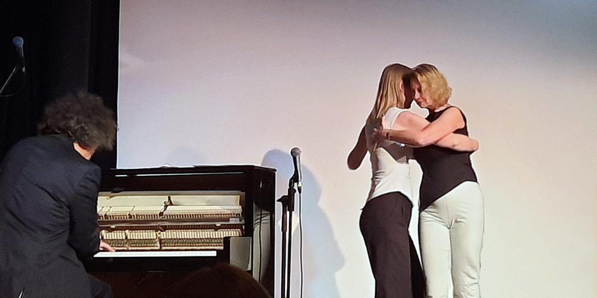 2 women doing the tango at the event.