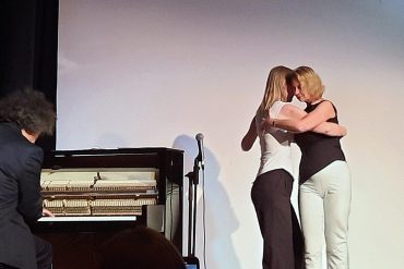 2 women doing the tango at the event.