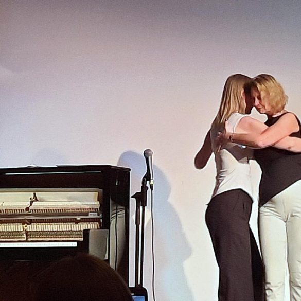 2 women doing the tango at the event.